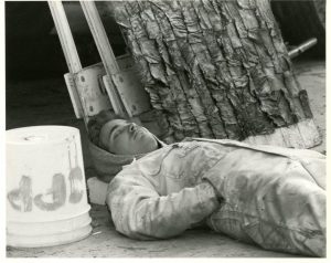 A student takes a nap from working on the 1984 float “A Knight To Remember.”