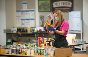 A staff member checking on items in the Poly Pantry